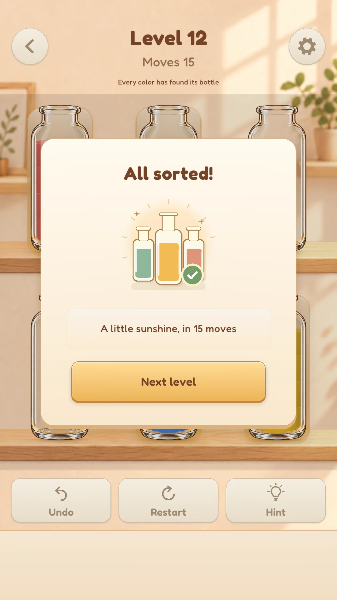 Level 12 completion screen with sorted bottles